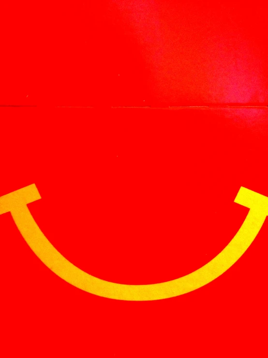 a close up of a sign with a smiley face drawn on it