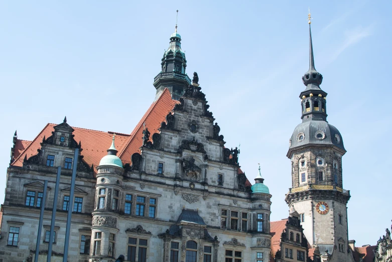 old buildings with large towers are pictured in a city