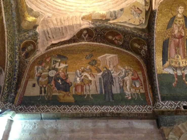 a painted ceiling showing people in ancient attire
