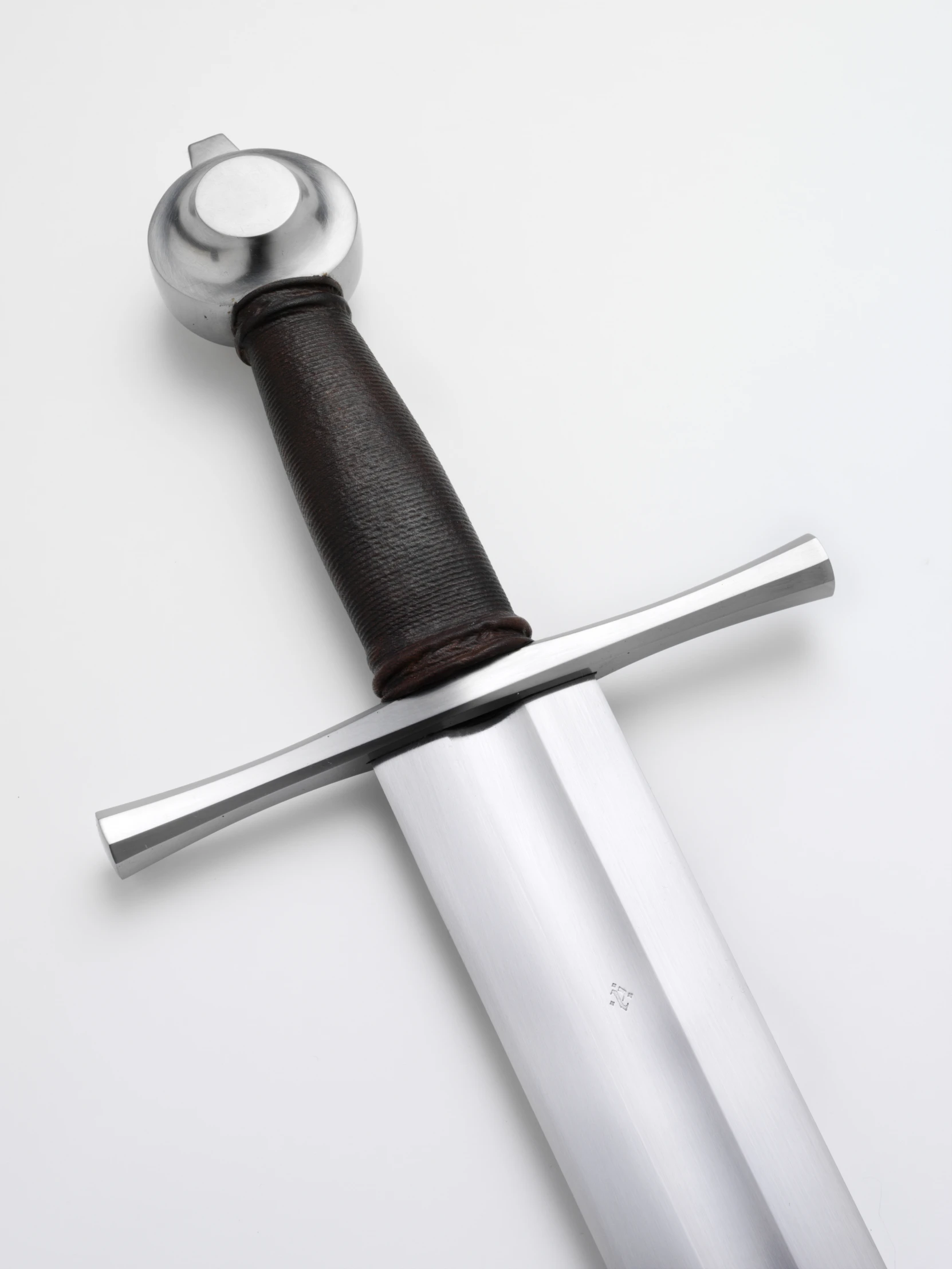 a sword with its handle attached sitting on top of a table