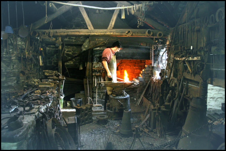 the man is working in an old wood stove