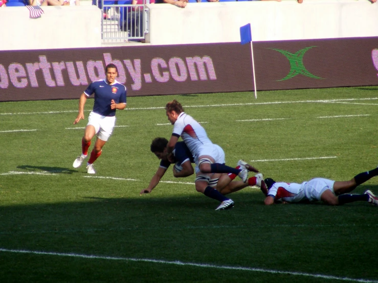 an athlete attempts to gain control of the ball