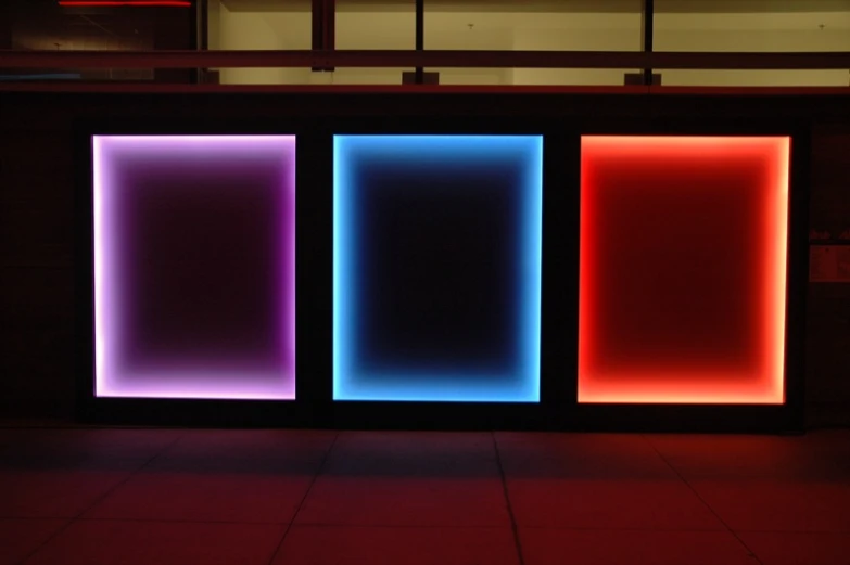 an illuminated wall that looks like three blocks