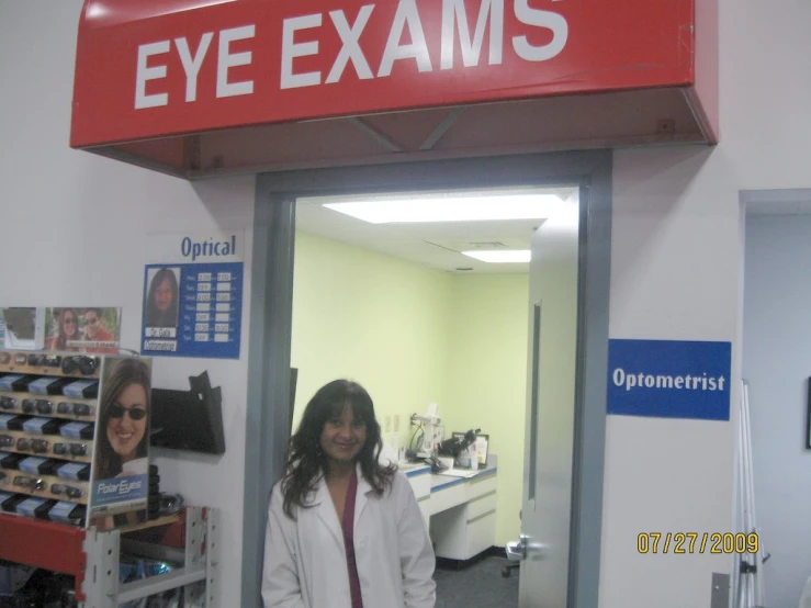 a woman standing in the entrance to a store