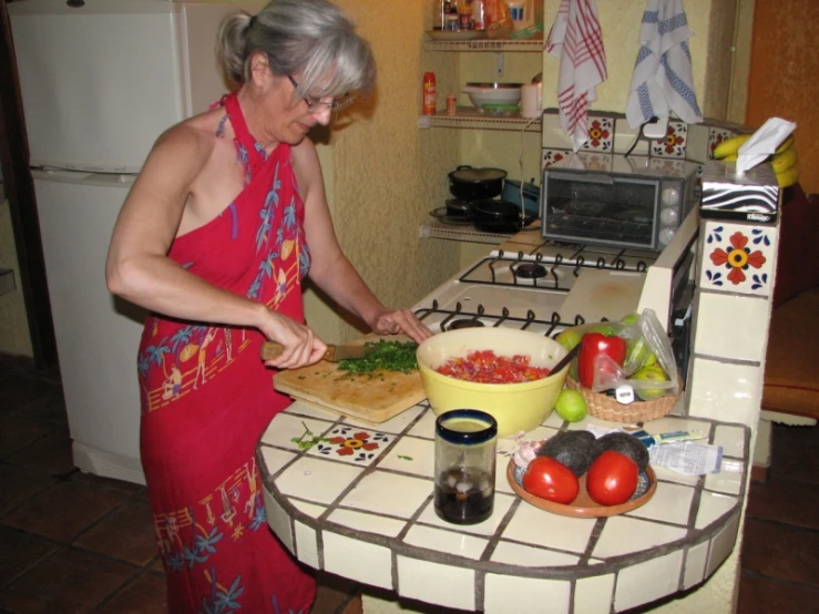 a woman in a red dress  up vegetables