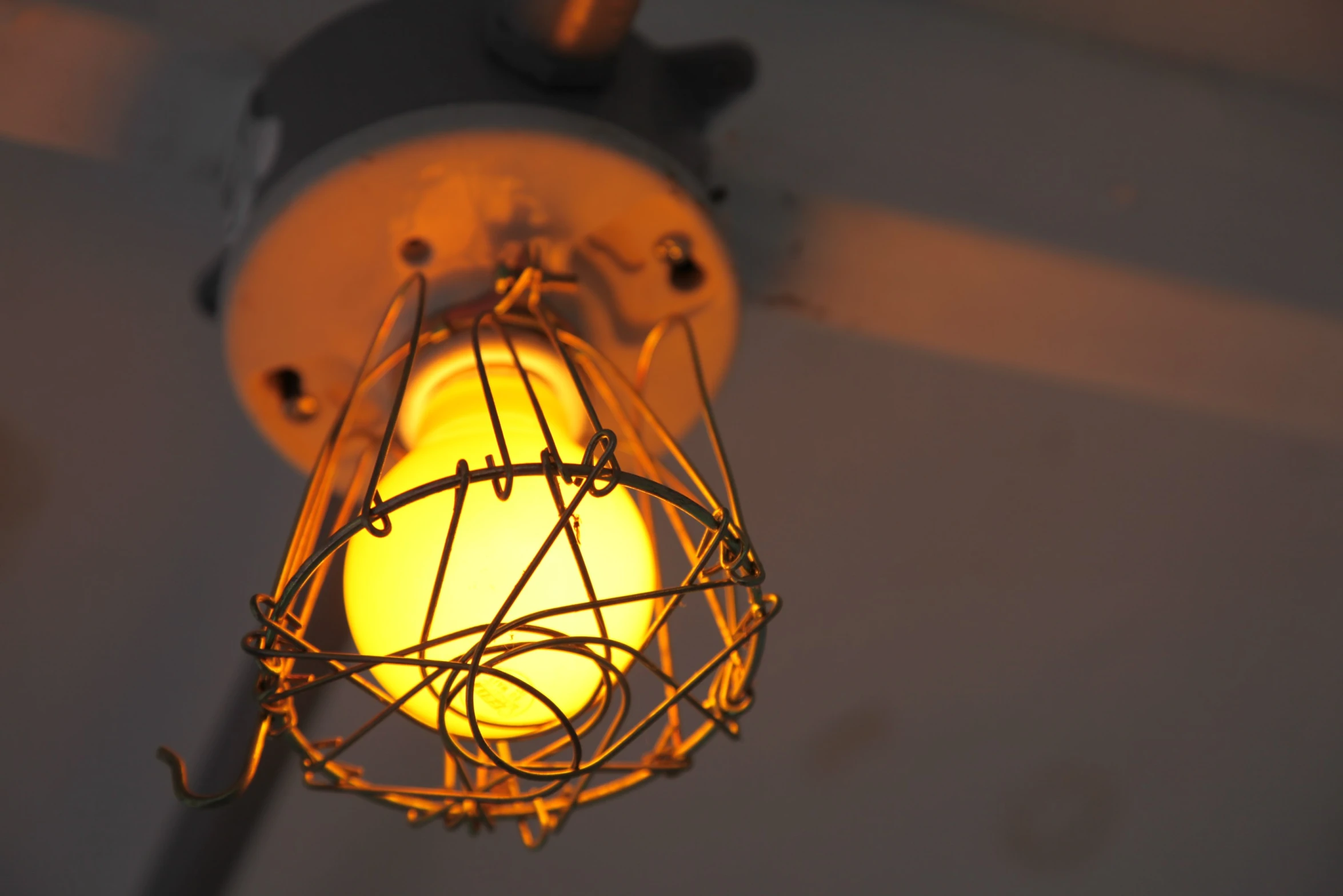 a yellow light on a ceiling in a room