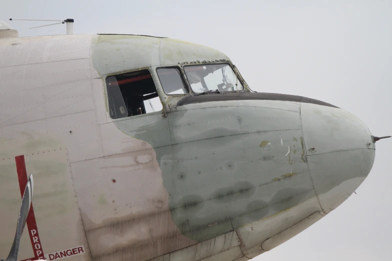 a big white plane with a door open