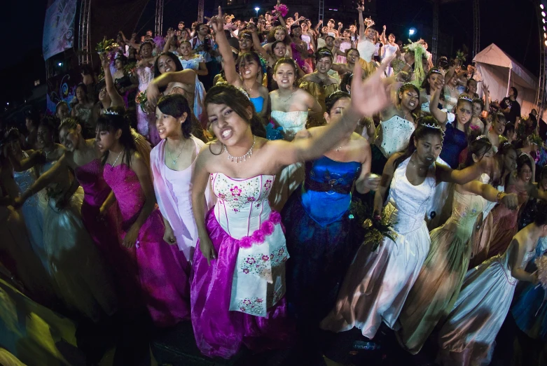 a group of people are dancing in the street