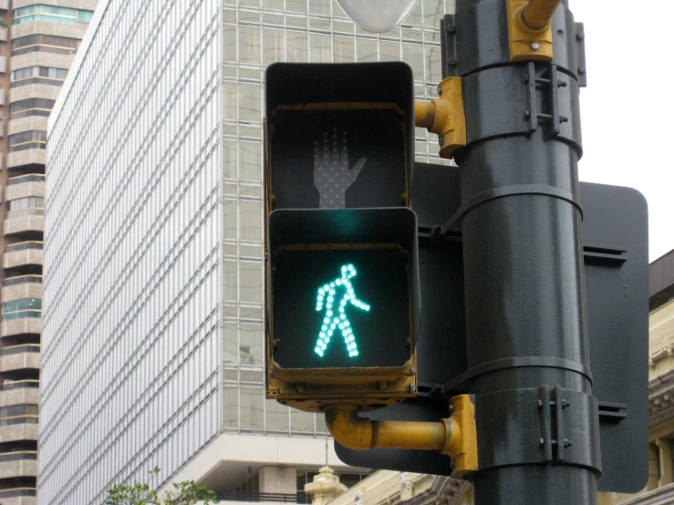 a traffic light shows the crosswalk in green
