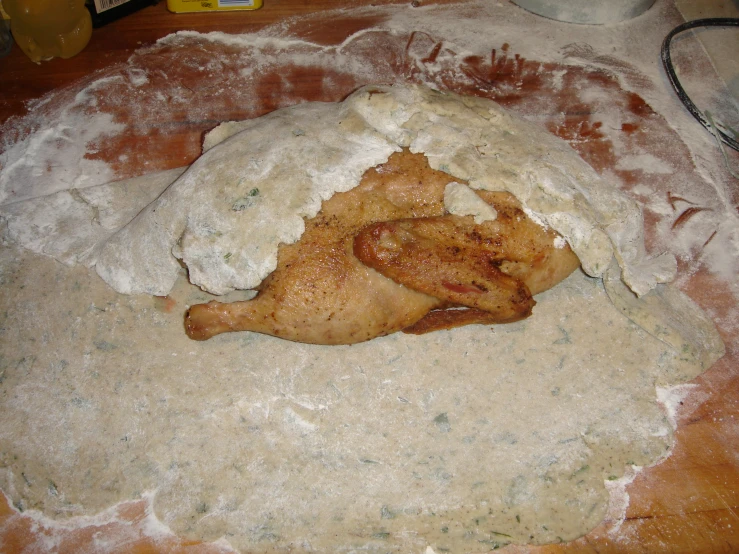 an uncooked pastry sitting on top of some wax