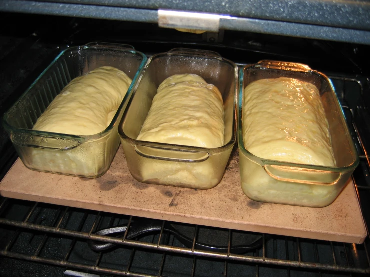 a bunch of bread in the oven ready for baking