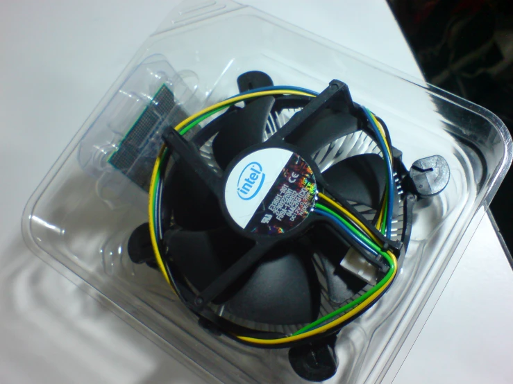 the cpu cooling system sits in its plastic container