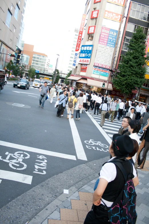 people are waiting for a car to pick up their luggage