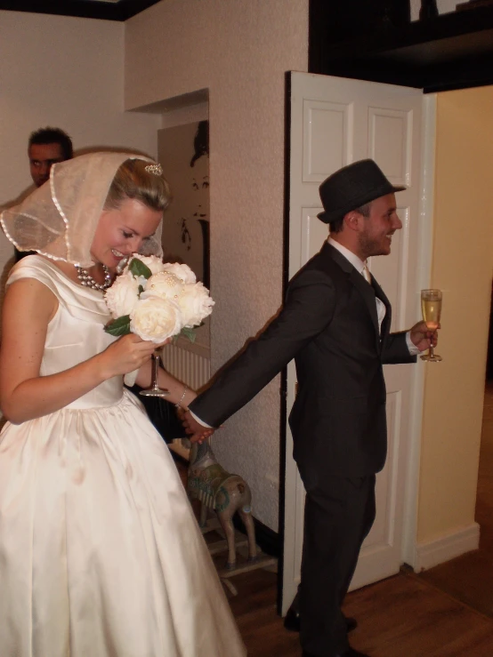 a couple in formal wear standing next to each other