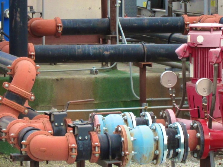 many colorful valves near each other and a pipe