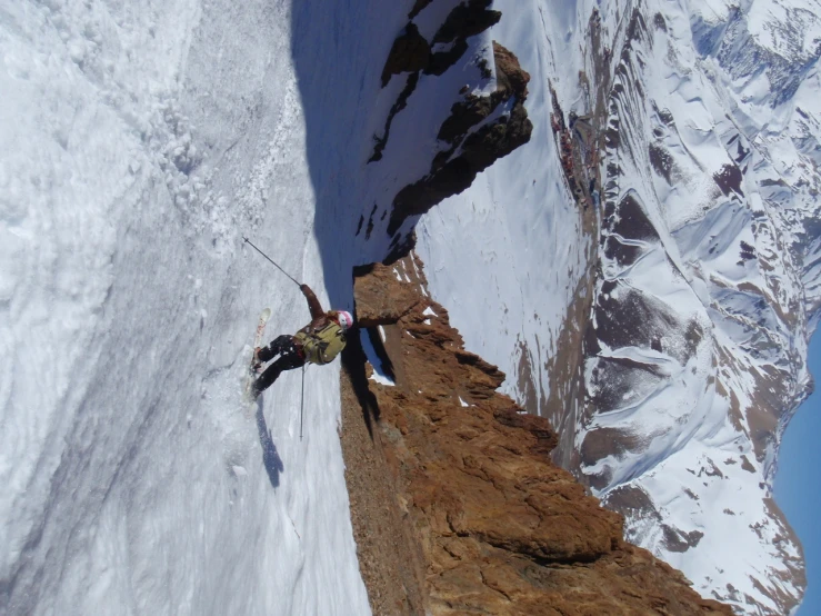 some skiers are attempting to climb a snowy hill