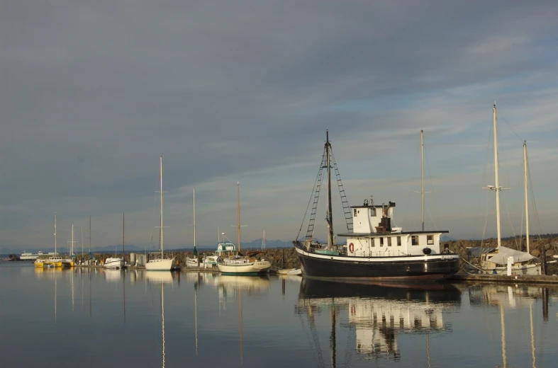 a boat that is in the water near another boat