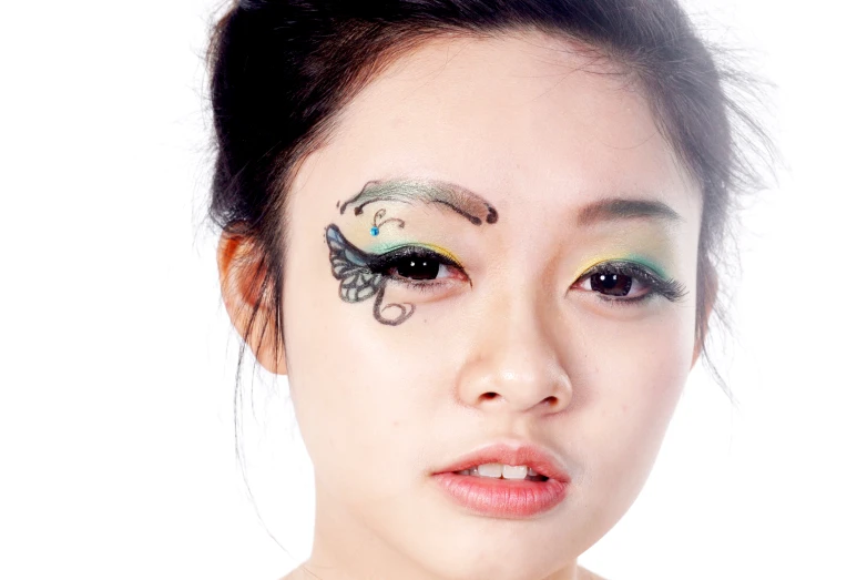 an oriental woman with an elaborate eye makeup
