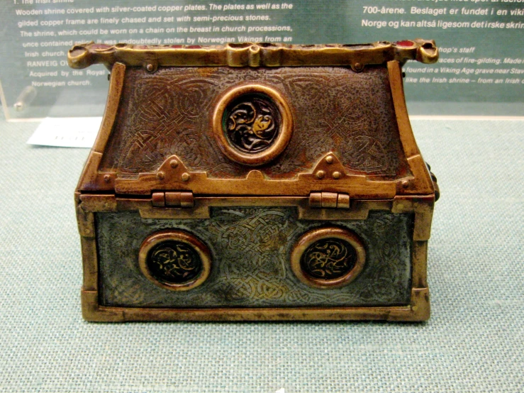 an odd little wooden box with several small doors