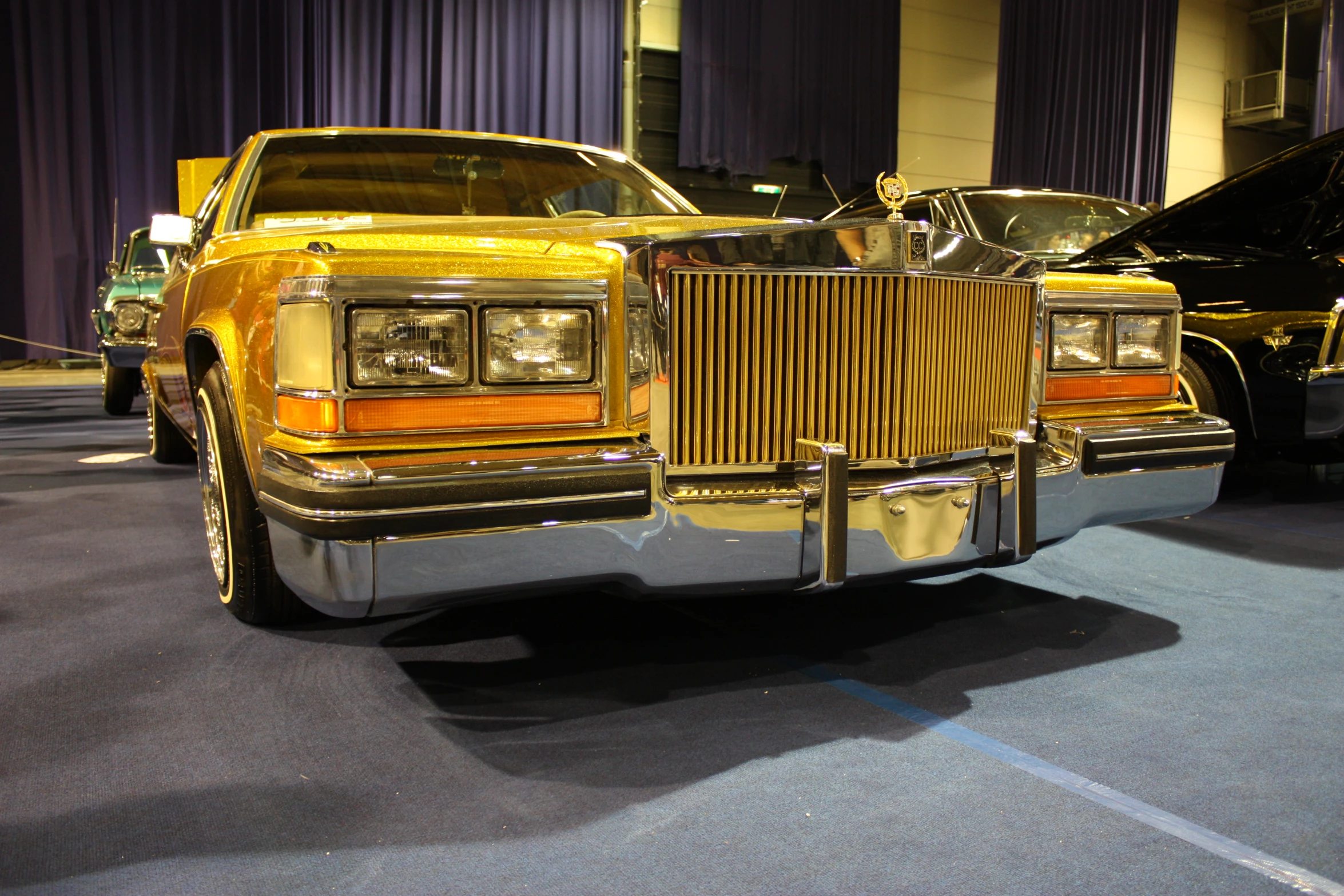 a fancy car with chrome parts on display