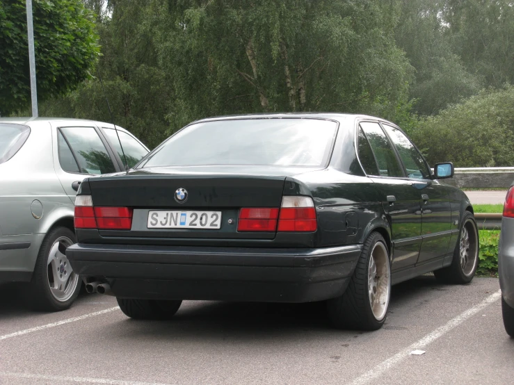 a couple of cars parked in a parking lot