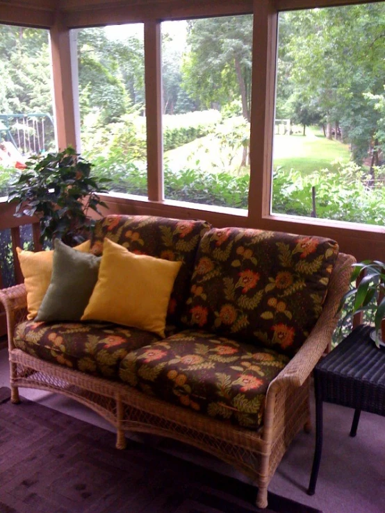 a living room filled with furniture and a bunch of windows