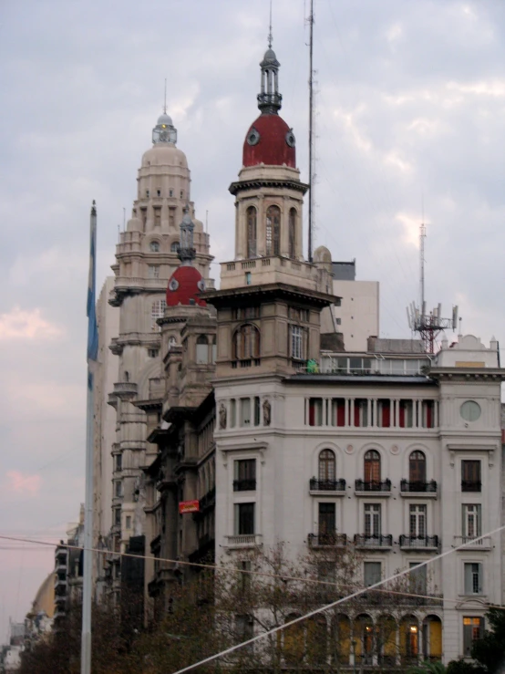 a building with multiple windows and a red dome