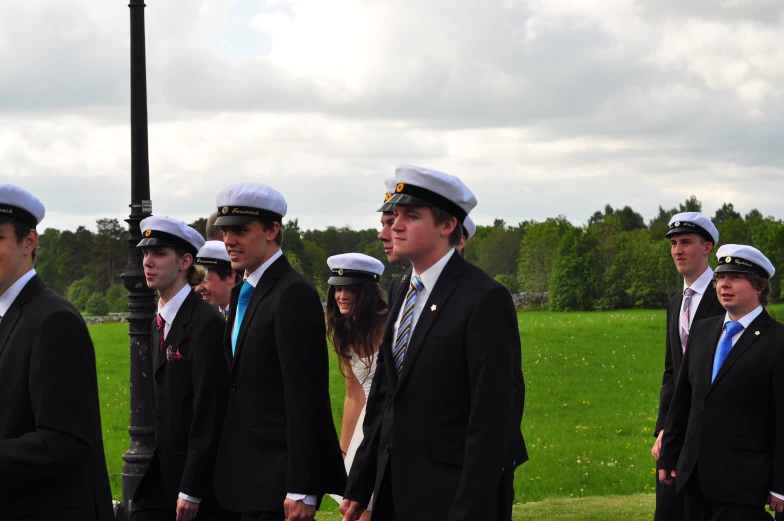 an image of a group of sailors taking a po