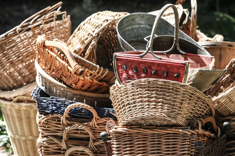 wicker baskets with woven handles stacked on top of each other