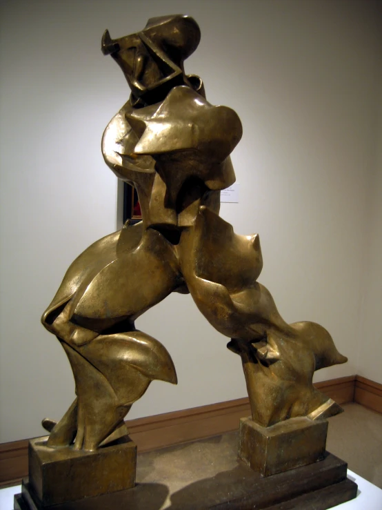 bronze statue of a man lifting a large bowl