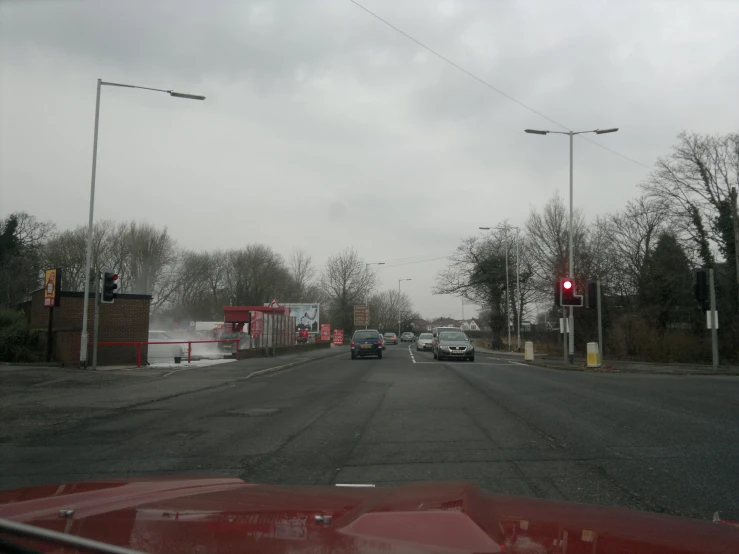 a view from inside the windshield of cars on a road