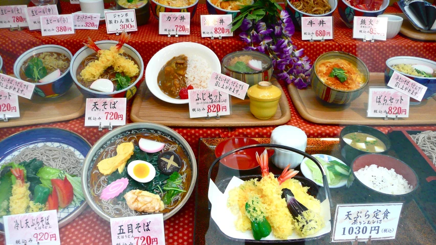 a bunch of different dishes are on display