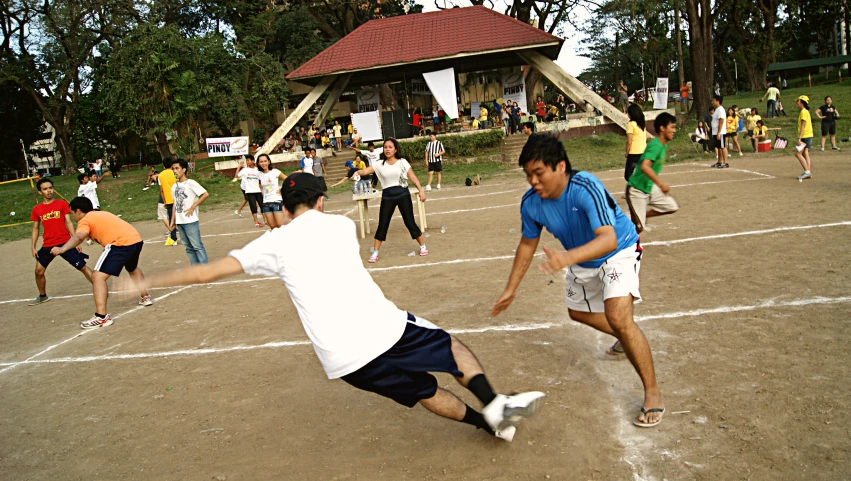 the young men are playing soccer together on the field