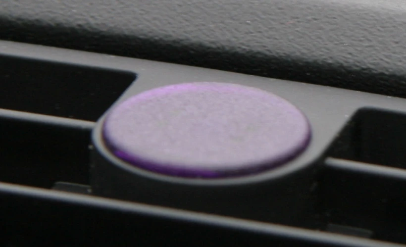 purple  that is on the center console of an older car