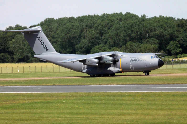 large military jet on tarmac of airport runway