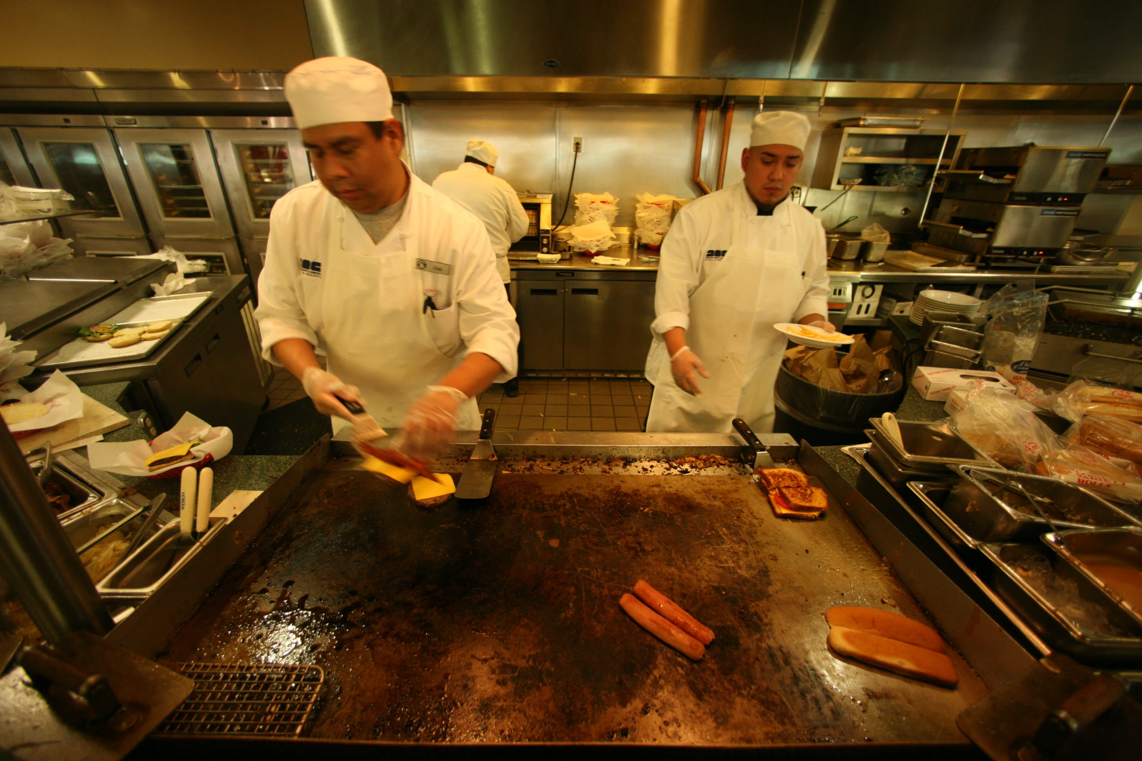 the cooks are working on their preparation at the restaurant