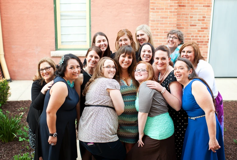 a group of women posing for a picture together