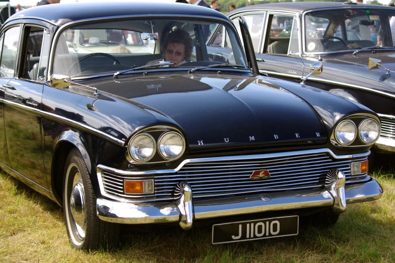 antique cars are on display at an event