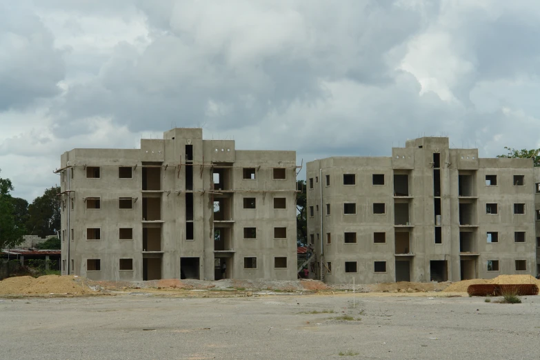 a big building with windows that are built in the sand