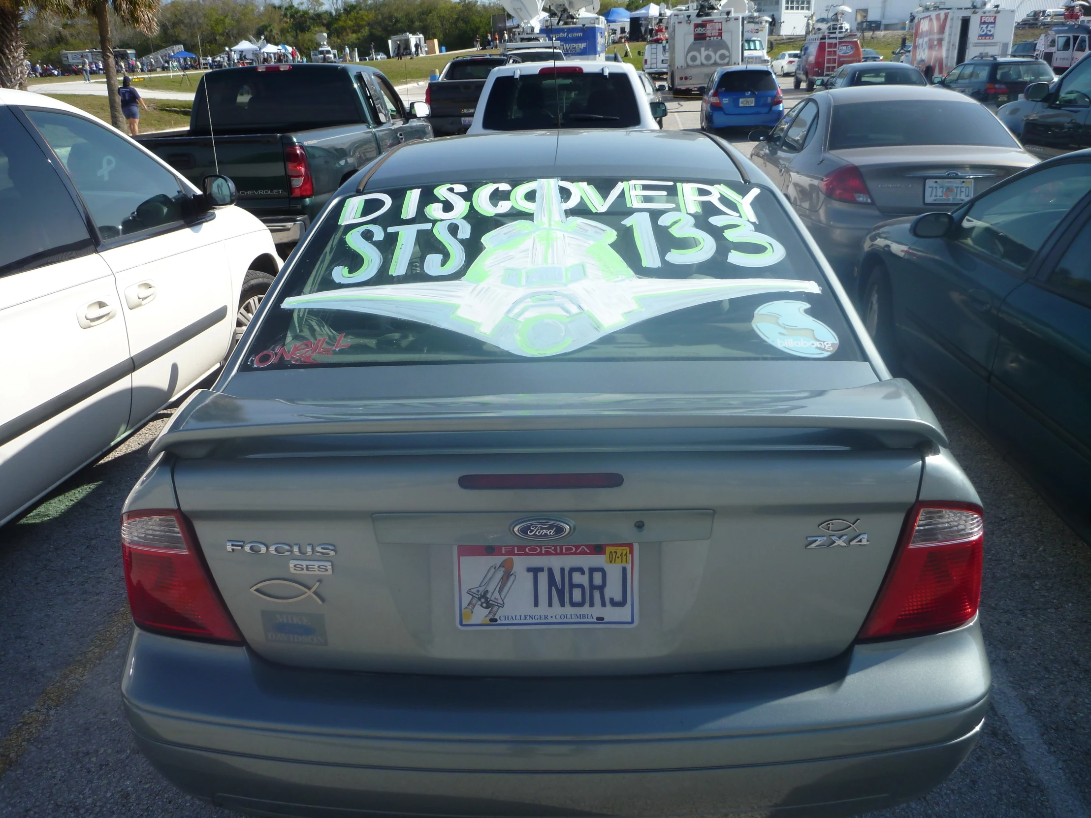 a parked car is covered in messages and graffiti