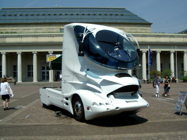 a large white semi truck with the hood lifted