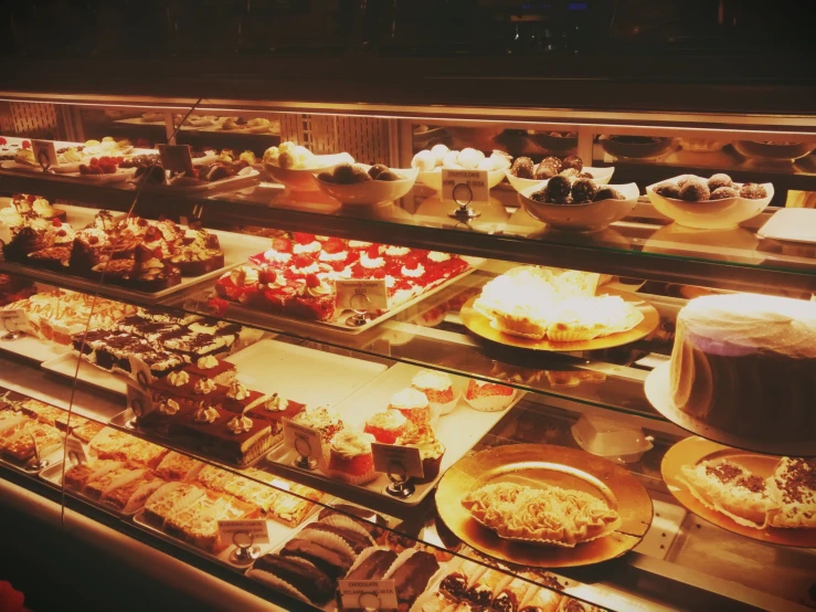 a large display of different desserts sitting on shelves