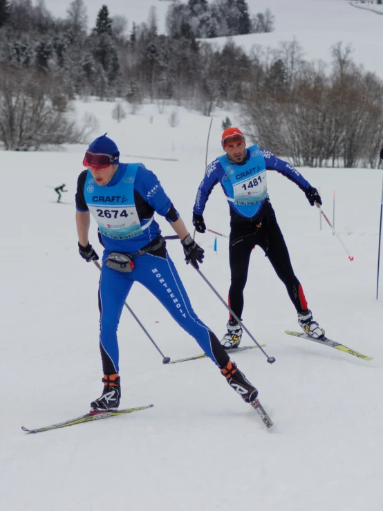 two people are skiing in their skis