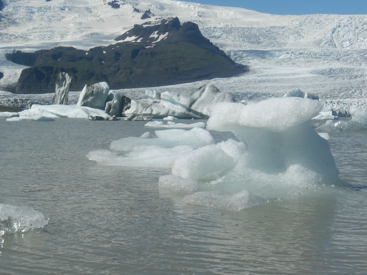 two ice chunks floating in the water