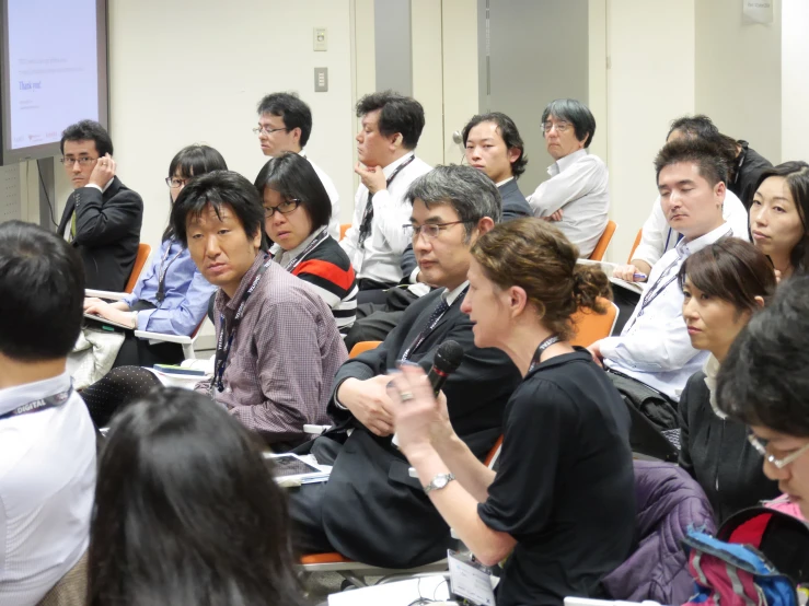 several people sitting and listening to a seminar