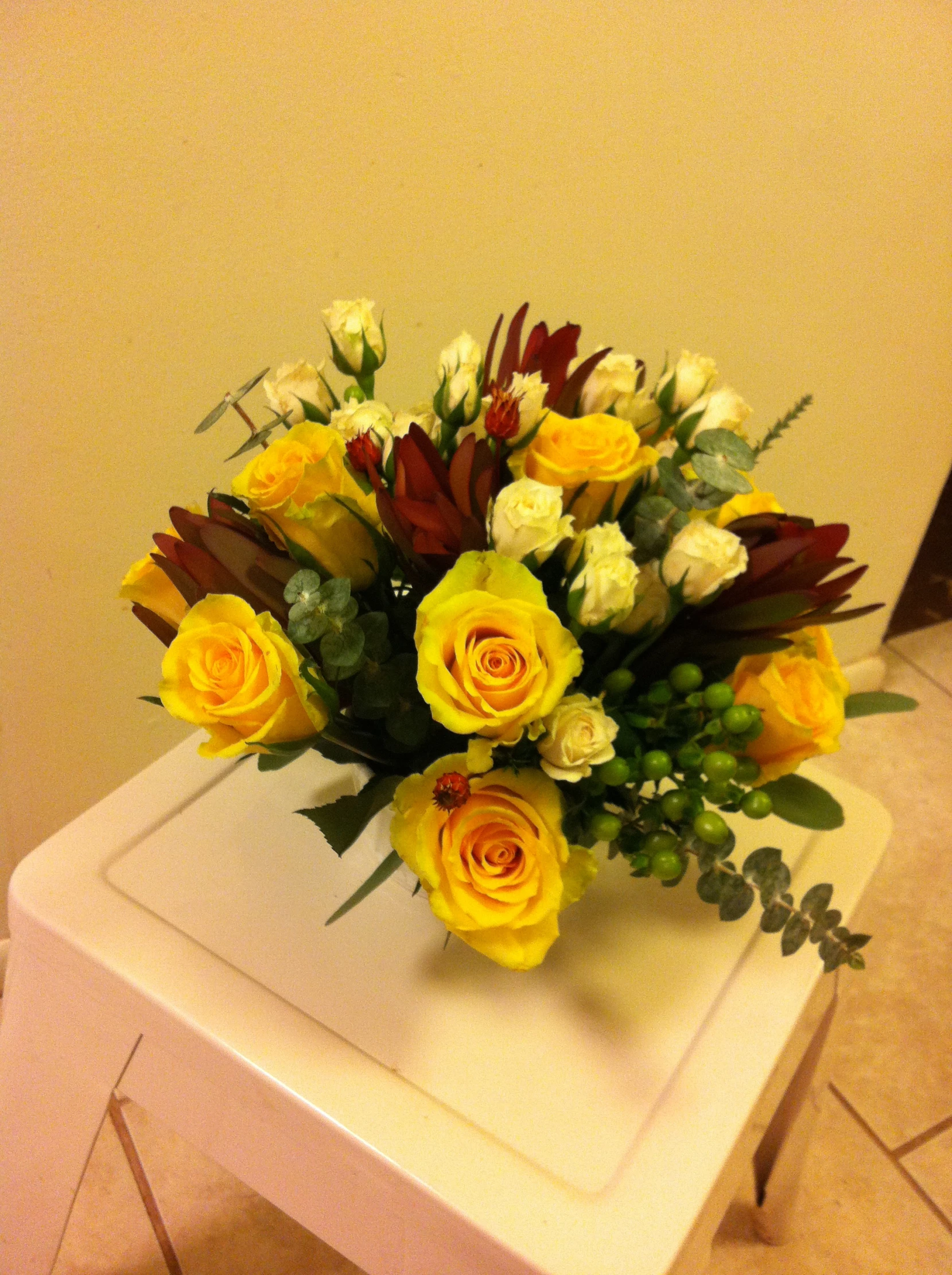 a bouquet is sitting on top of a chair