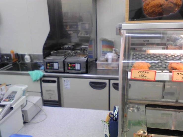 an industrial kitchen with multiple cooking devices in it