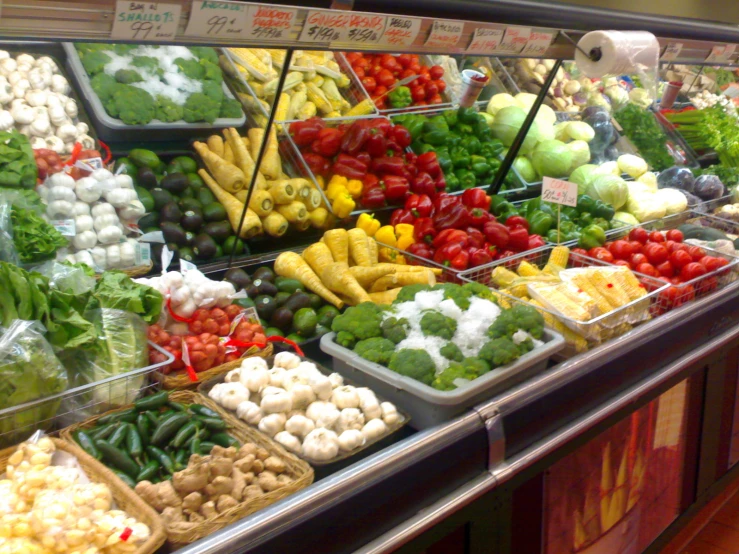 many different types of vegetables are displayed in baskets