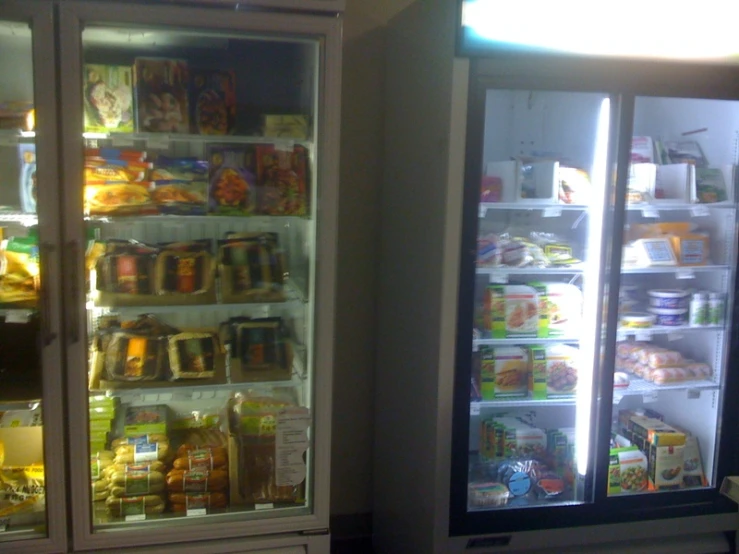 an empty refrigerator with several shelves full of food