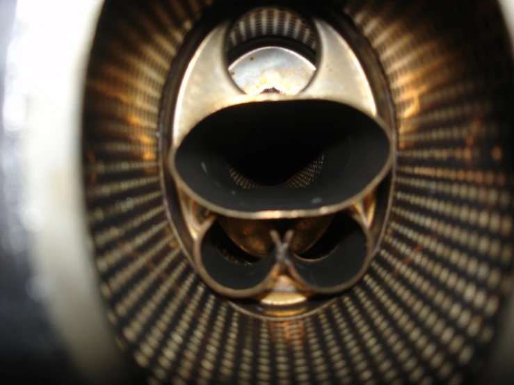 closeup of several metal tubes on top of a stove